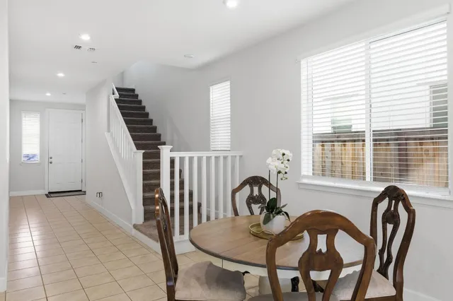 a view of a dining room with furniture and window