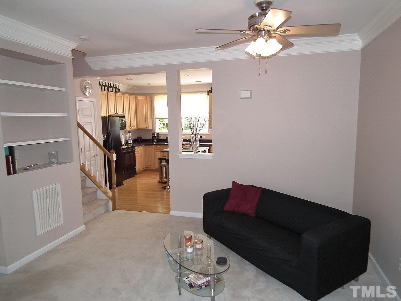 5318 Echo Ridge Road Raleigh, NC 27612 - Photo 14 of 25 a living room with furniture flowerpot and window