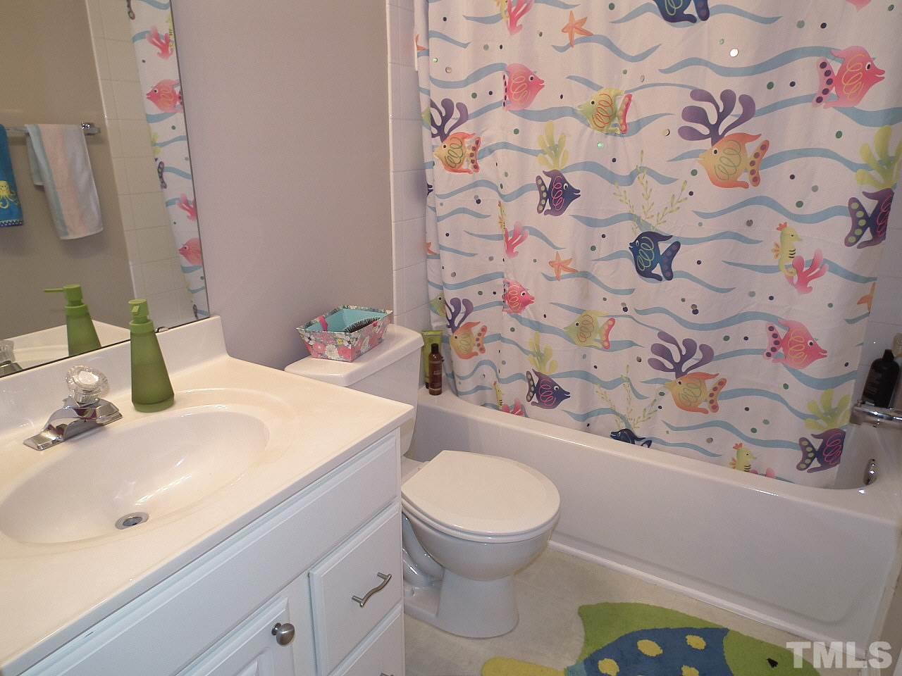 5318 Echo Ridge Road Raleigh, NC 27612 - Photo 25 of 25 a bathroom with a sink toilet and shower
