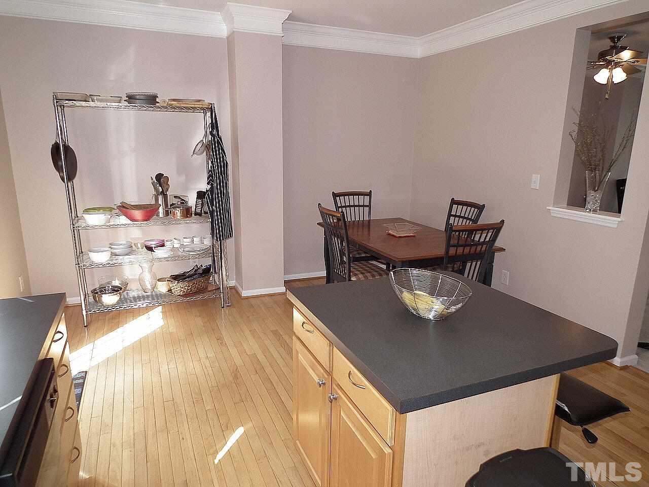 5318 Echo Ridge Road Raleigh, NC 27612 - Photo 6 of 25 a view of a dining room with furniture