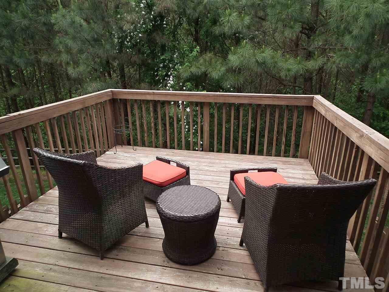 5318 Echo Ridge Road Raleigh, NC 27612 - Photo 8 of 25 a view of a chair and table on the deck