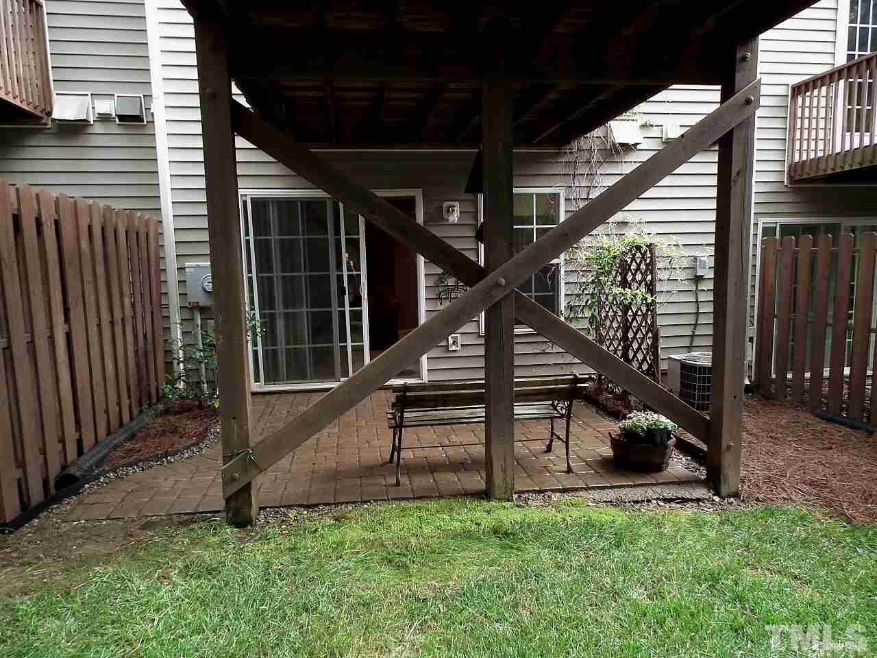 5318 Echo Ridge Road Raleigh, NC 27612 - Photo 10 of 25 a view of backyard with deck and wooden stairs
