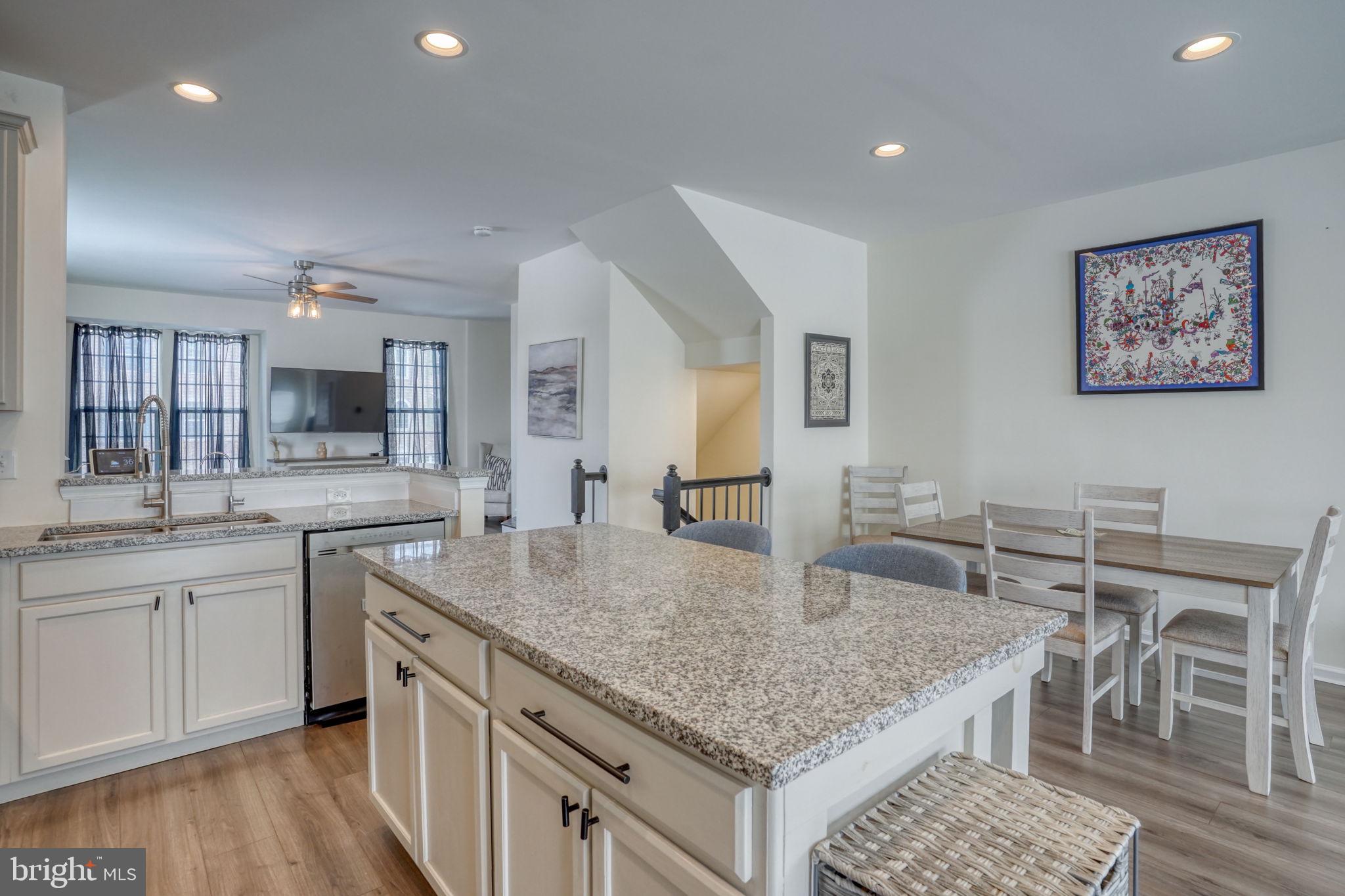 602 Barrie Road Middletown, DE 19709 - Photo 2 of 35 a kitchen with center island table and chairs