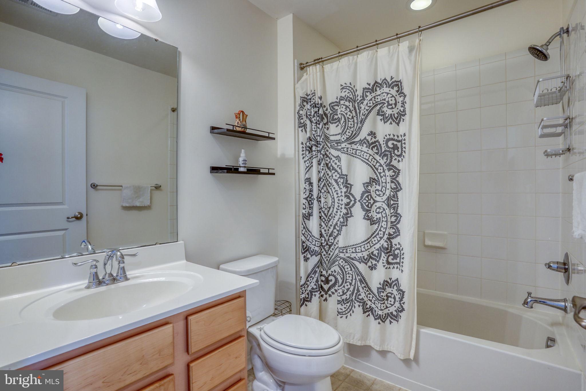 602 Barrie Road Middletown, DE 19709 - Photo 21 of 35 a bathroom with a sink toilet and shower