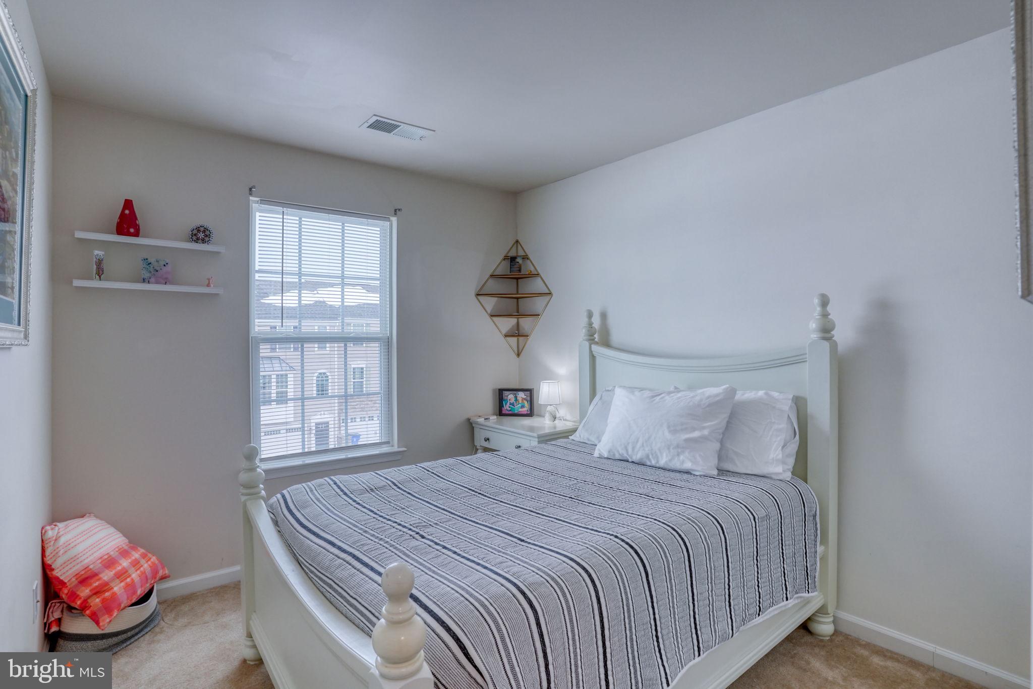602 Barrie Road Middletown, DE 19709 - Photo 24 of 35 a bedroom with a bed and a window