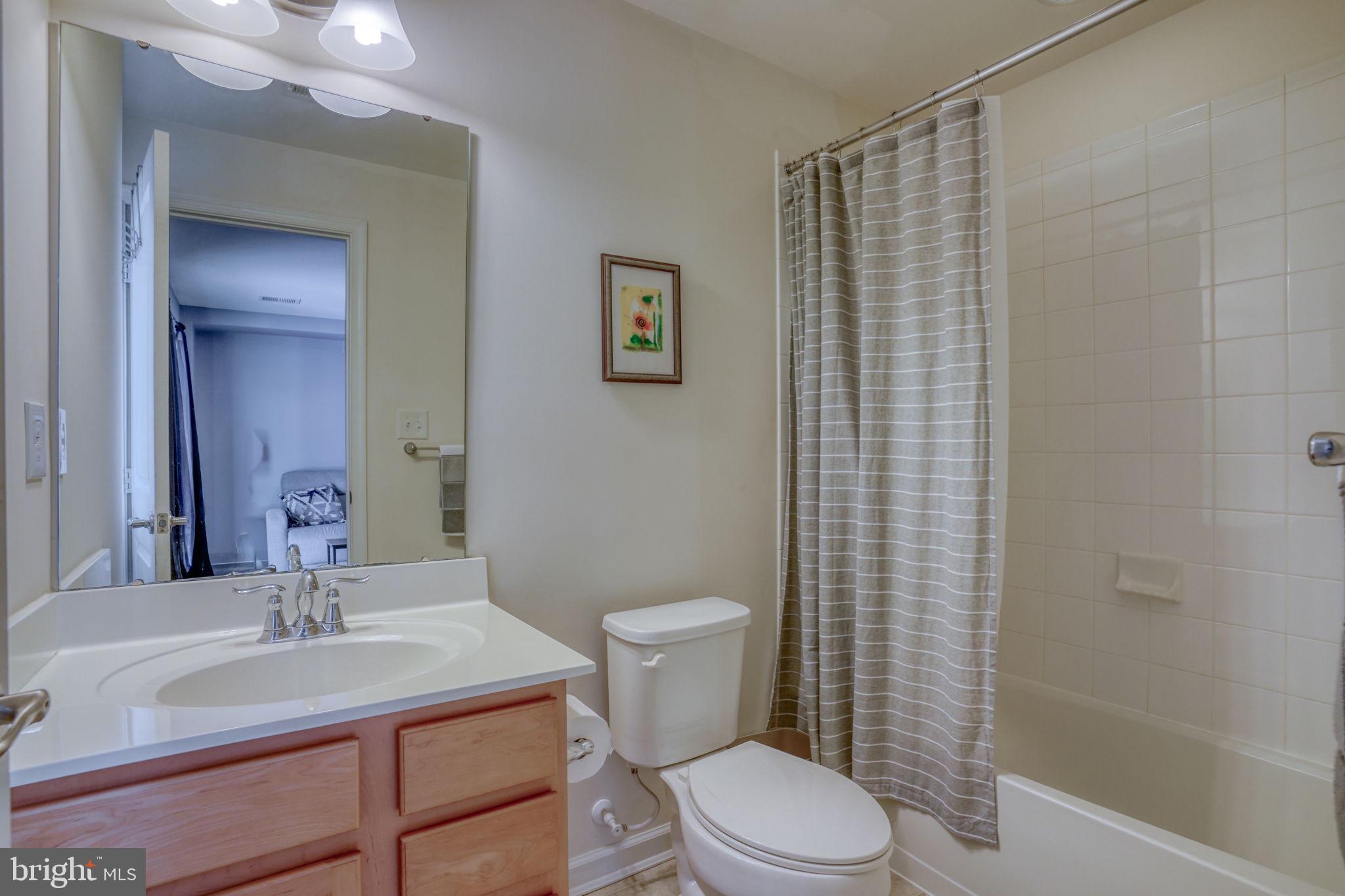 602 Barrie Road Middletown, DE 19709 - Photo 25 of 35 a bathroom with a sink a toilet and shower