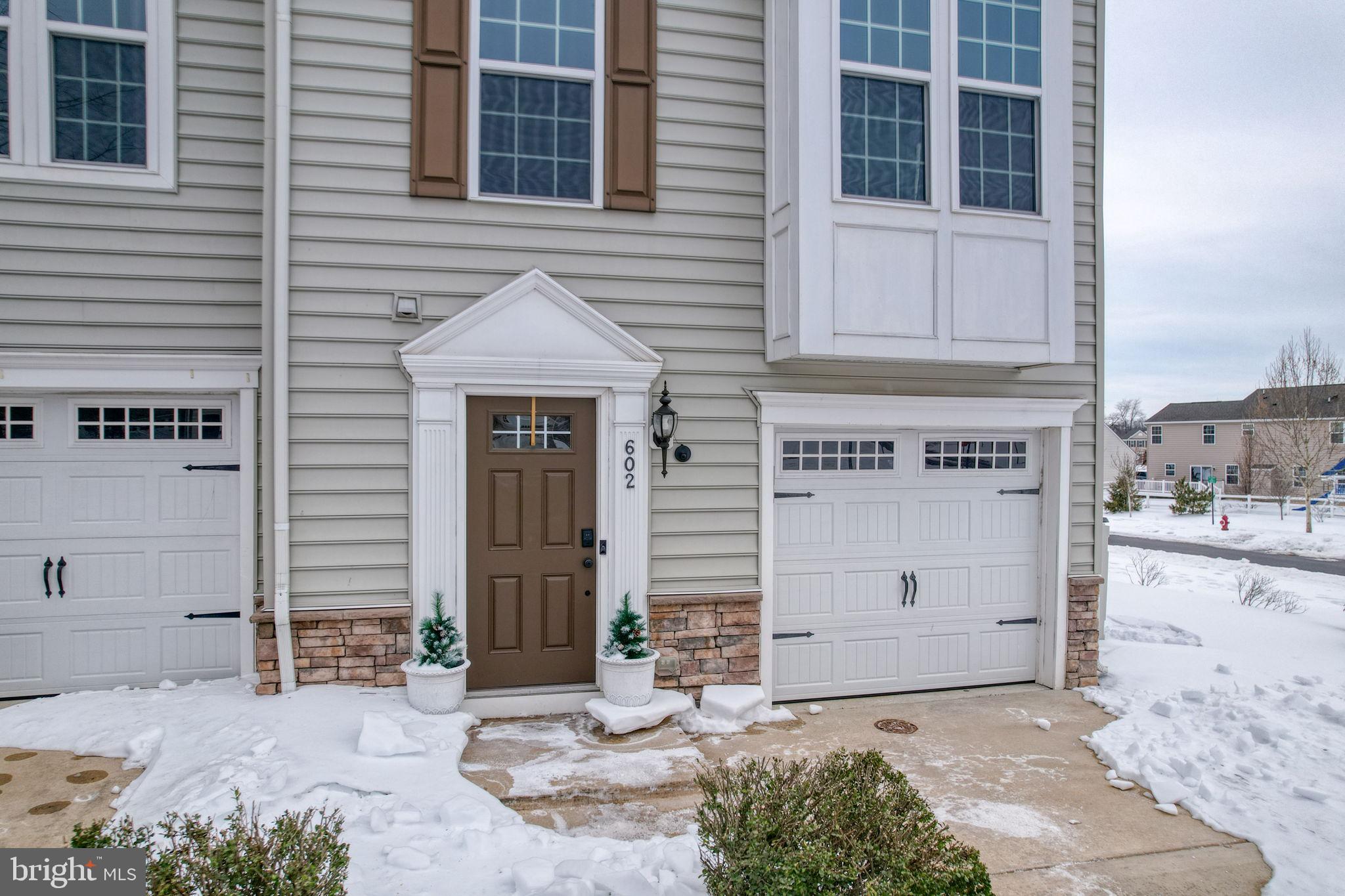 602 Barrie Road Middletown, DE 19709 - Photo 30 of 35 a front view of a house with a yard and garage