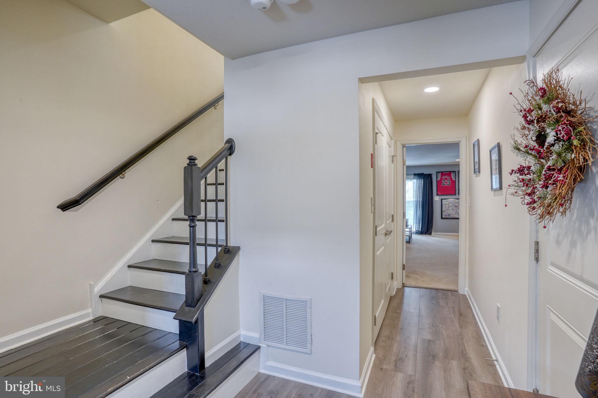 602 Barrie Road Middletown, DE 19709 - Photo 4 of 35 a view of a hallway with wooden floor and staircase
