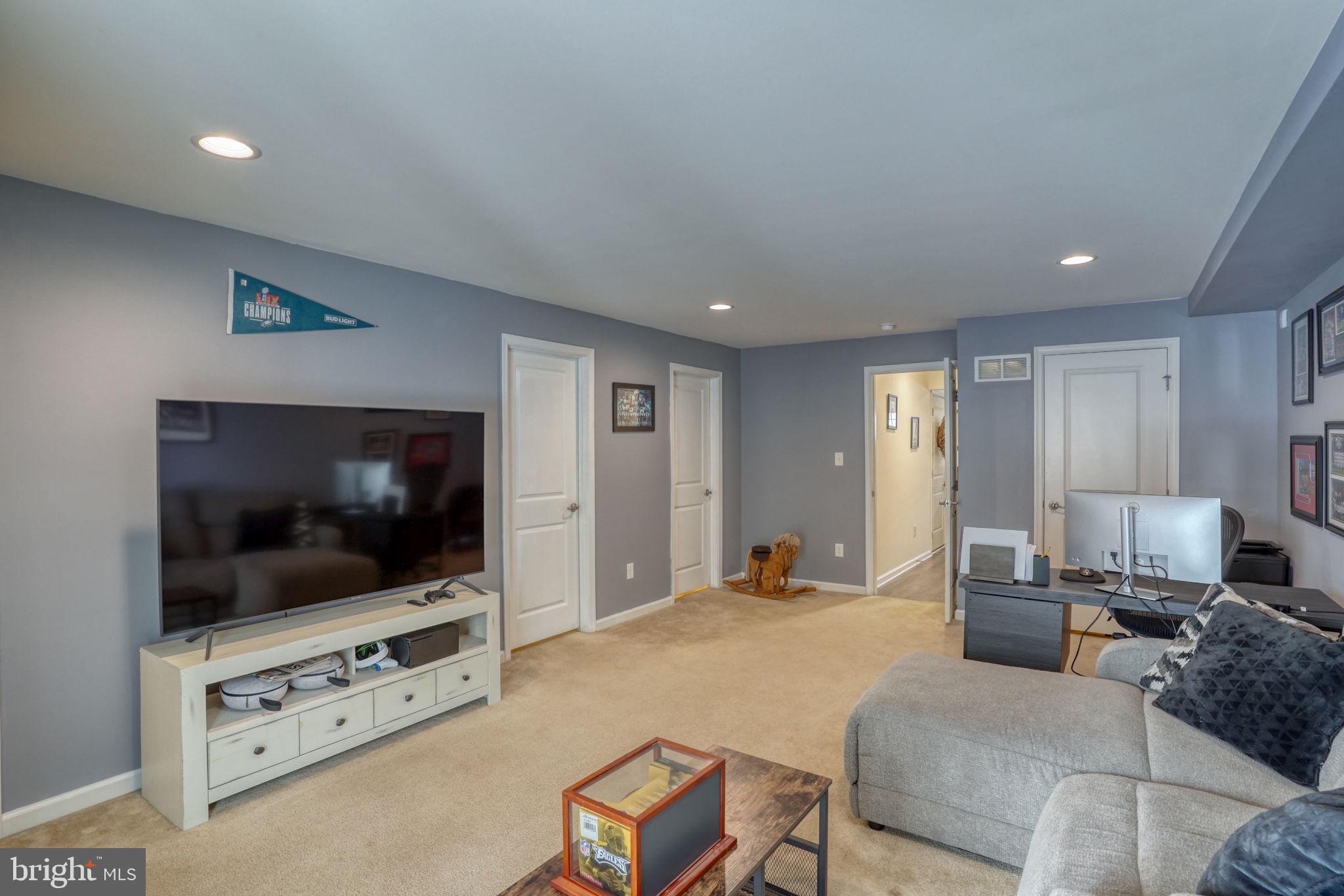 602 Barrie Road Middletown, DE 19709 - Photo 7 of 35 a living room with furniture and a flat screen tv