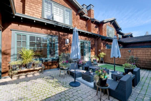 a building outdoor space with lots of potted plants