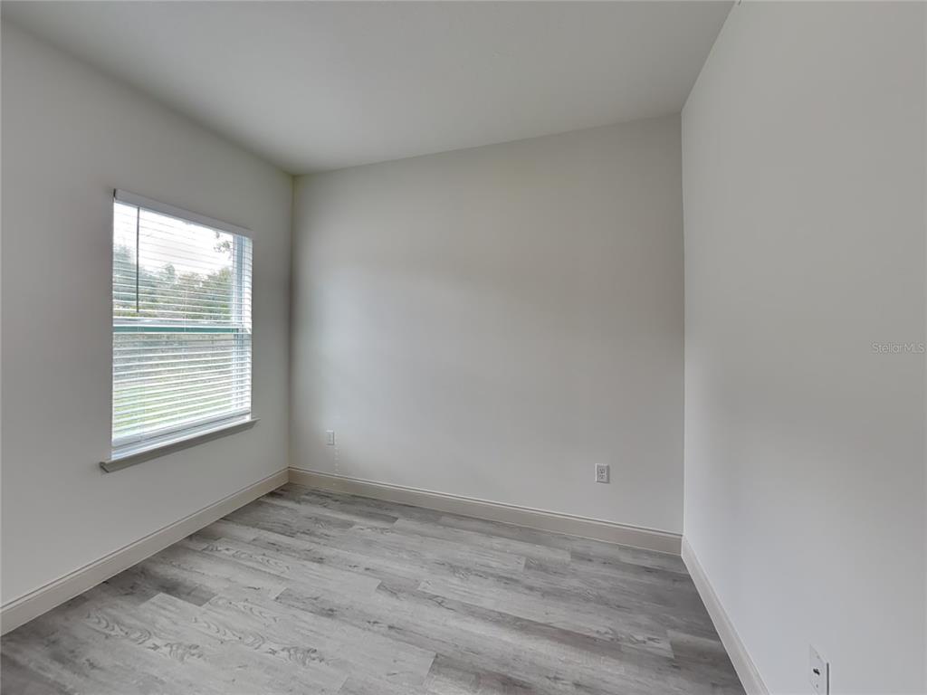 7780 North Maltese Drive Citrus Springs, FL 34433 - Photo 12 of 16 an empty room with a window