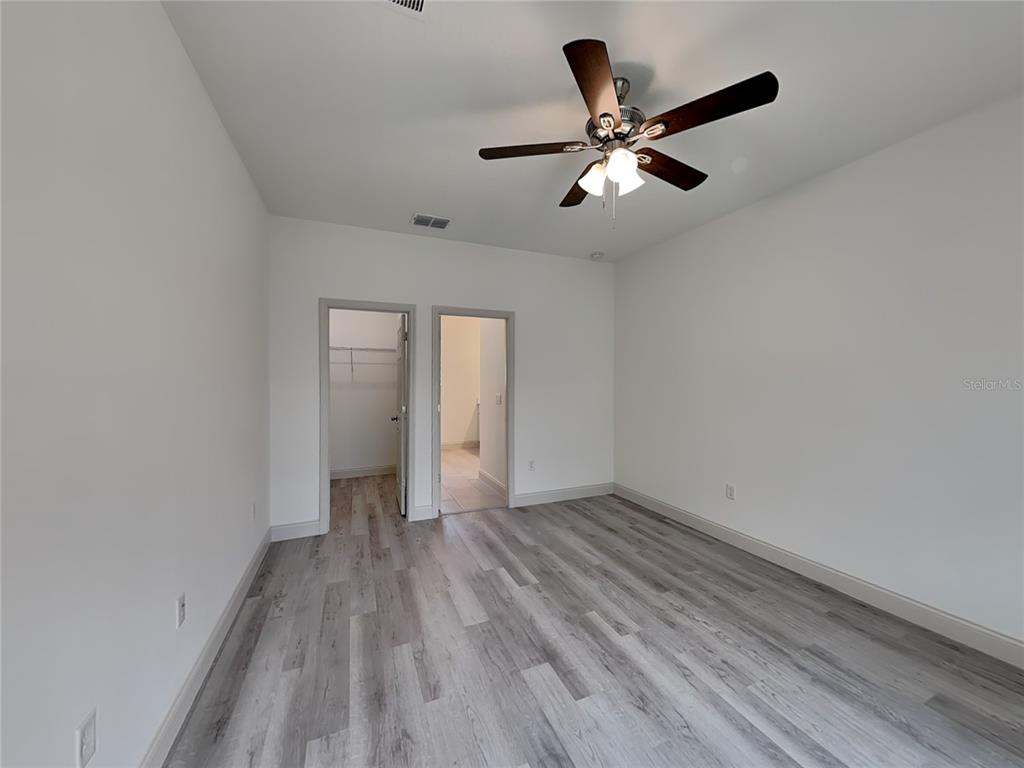 7780 North Maltese Drive Citrus Springs, FL 34433 - Photo 7 of 16 a view of empty room with wooden floor