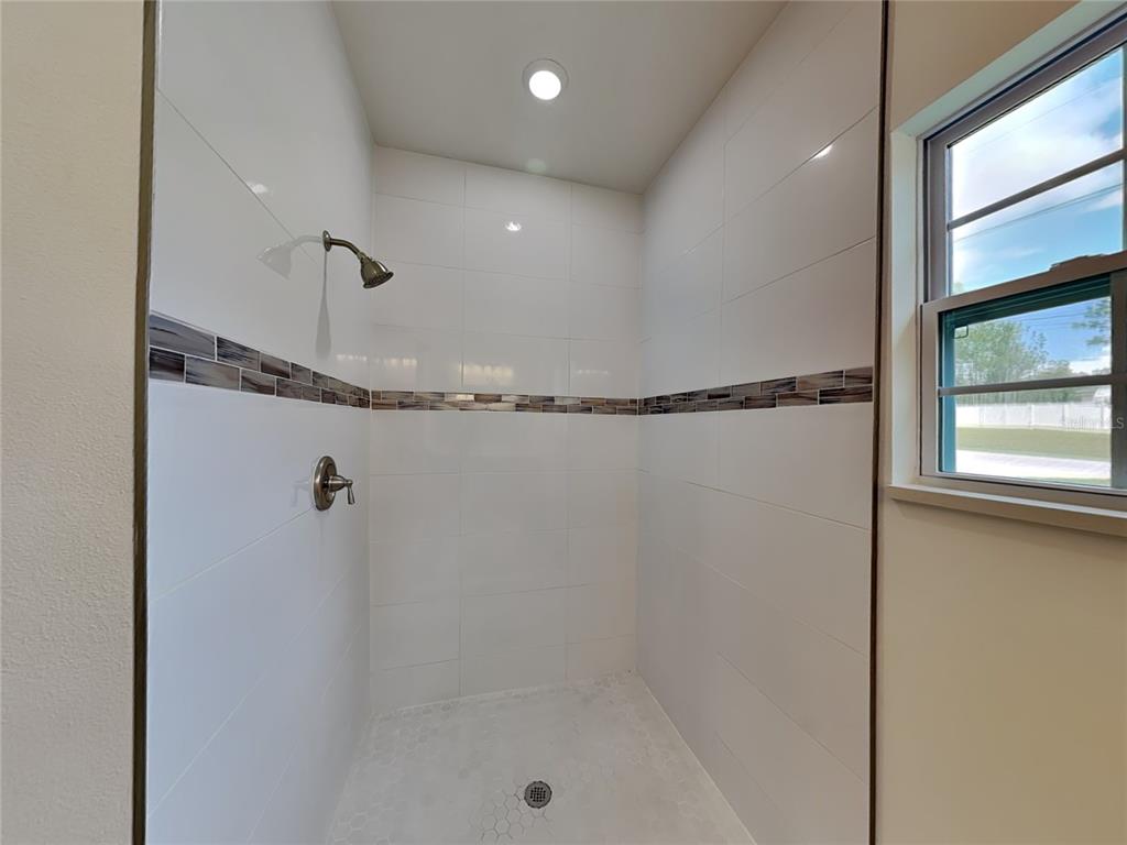 7780 North Maltese Drive Citrus Springs, FL 34433 - Photo 9 of 16 a bathroom with a shower and a tub