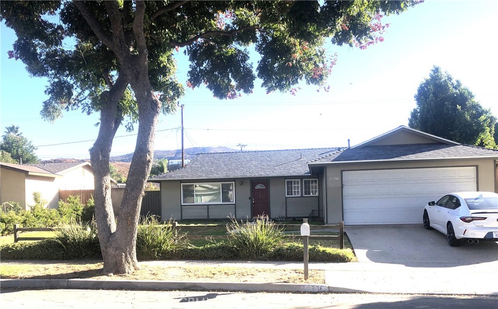 2206 Stinson Street Simi Valley, CA 93065 - Photo 1 of 2 a front view of a house with garden and parking