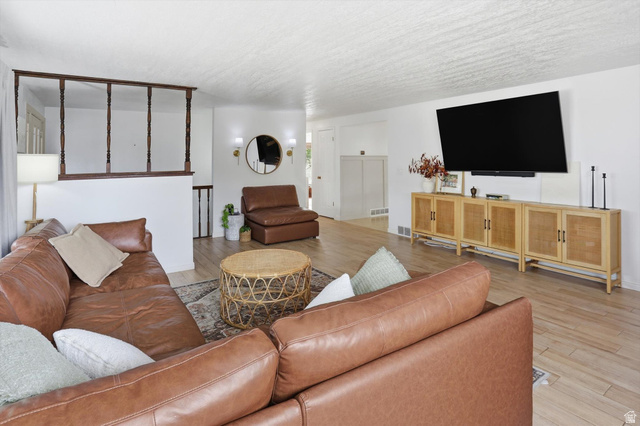 5108 South 2000th Street West Roy, UT 84067 - Photo 4 of 61 Living area with light wood-style flooring