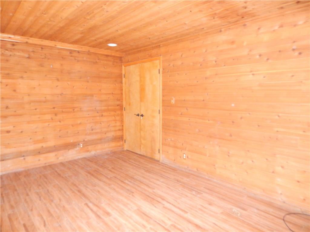 350 Plum Run Road Canonsburg, PA 15317 - Photo 16 of 20 Lower Level den with cedar ceiling and walls and laminate flooring. The area is off of the game room and can have flexibility in use. Some ideas would be den, office, gym, playroom etc.