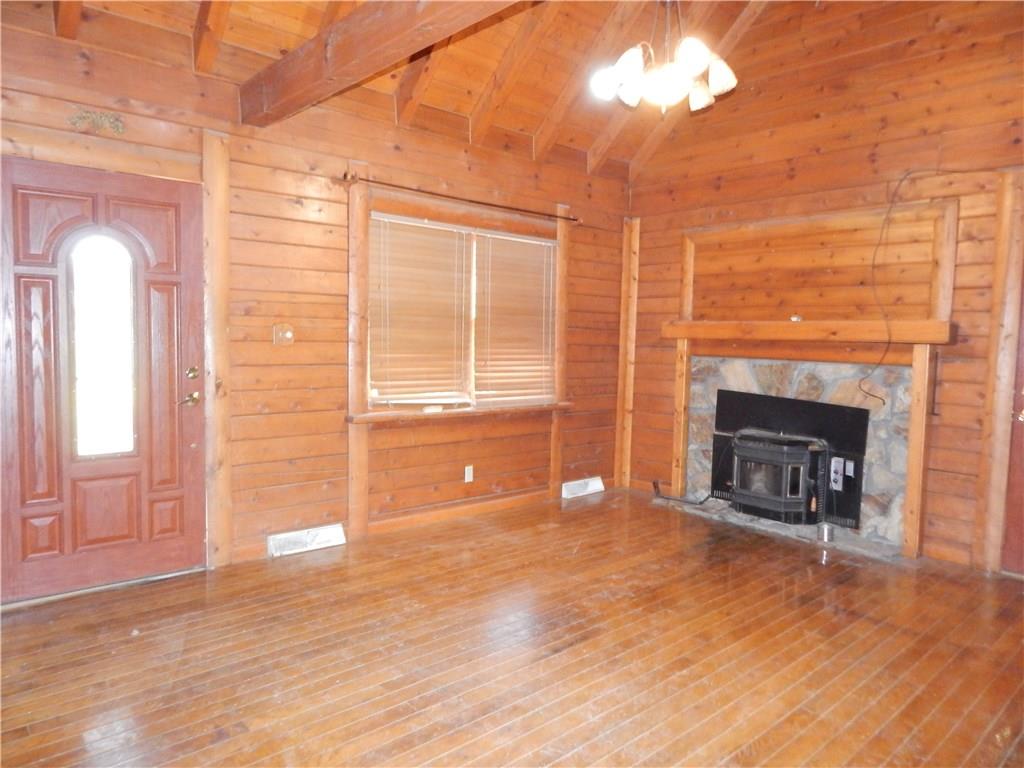 350 Plum Run Road Canonsburg, PA 15317 - Photo 4 of 20 Formal Living Room with cedar cathedral ceiling and cedar walls, and hard wood flooring reclaimed from a bowling alley.