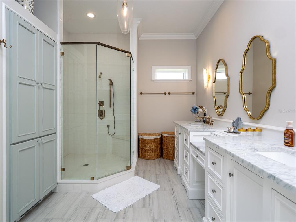 15225 Northwest 112th Place Road Morriston, FL 32668 - Photo 12 of 39 a spacious bathroom with a double vanity sink mirror and shower
