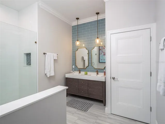 a room with a sink and a mirror