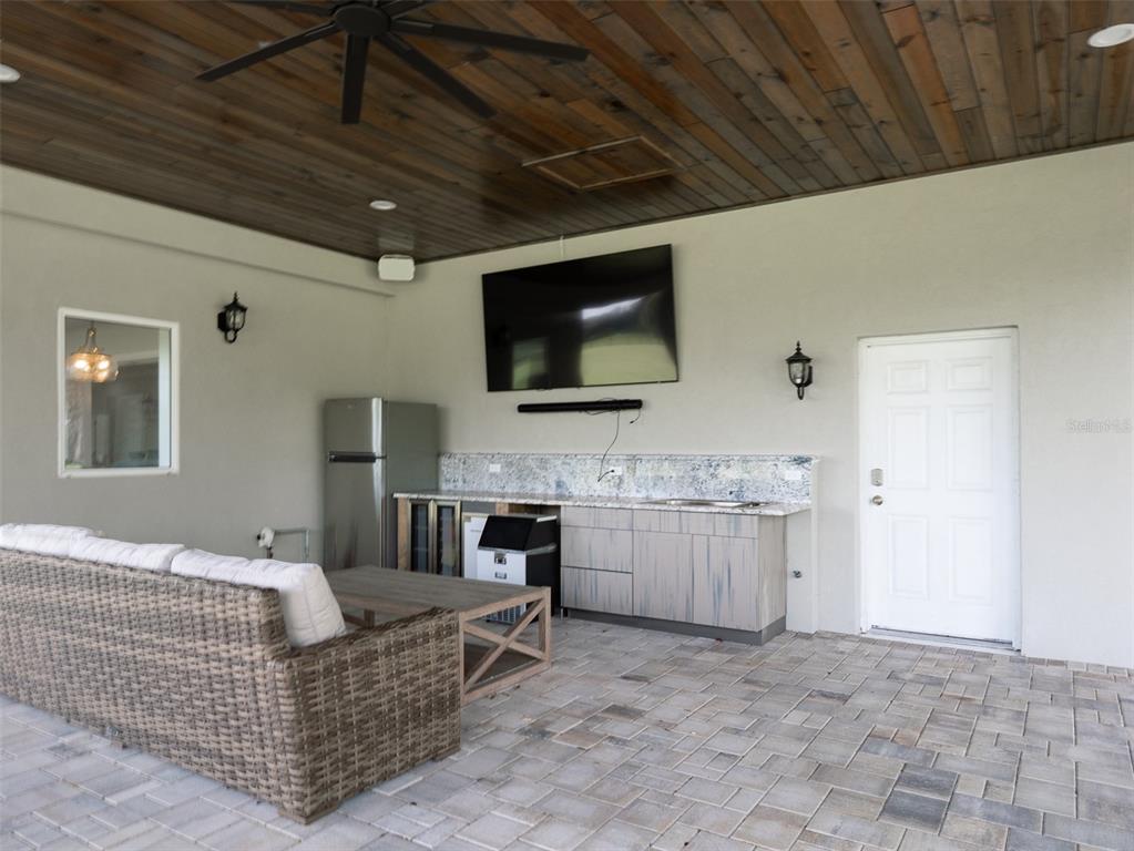15225 Northwest 112th Place Road Morriston, FL 32668 - Photo 17 of 39 a living room with furniture and a flat screen tv