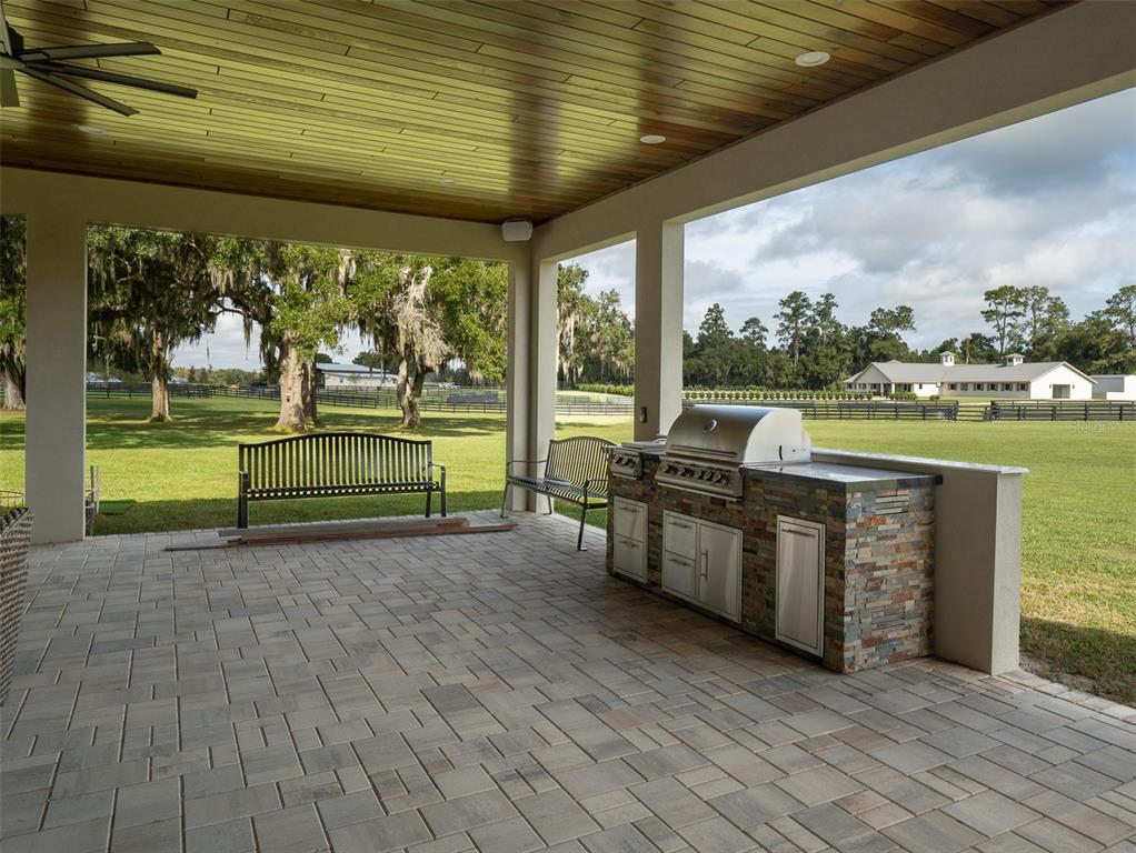 15225 Northwest 112th Place Road Morriston, FL 32668 - Photo 18 of 39 a view of a swimming pool with a patio