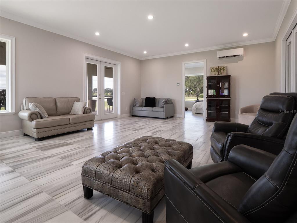 15225 Northwest 112th Place Road Morriston, FL 32668 - Photo 28 of 39 a living room with furniture and a couch