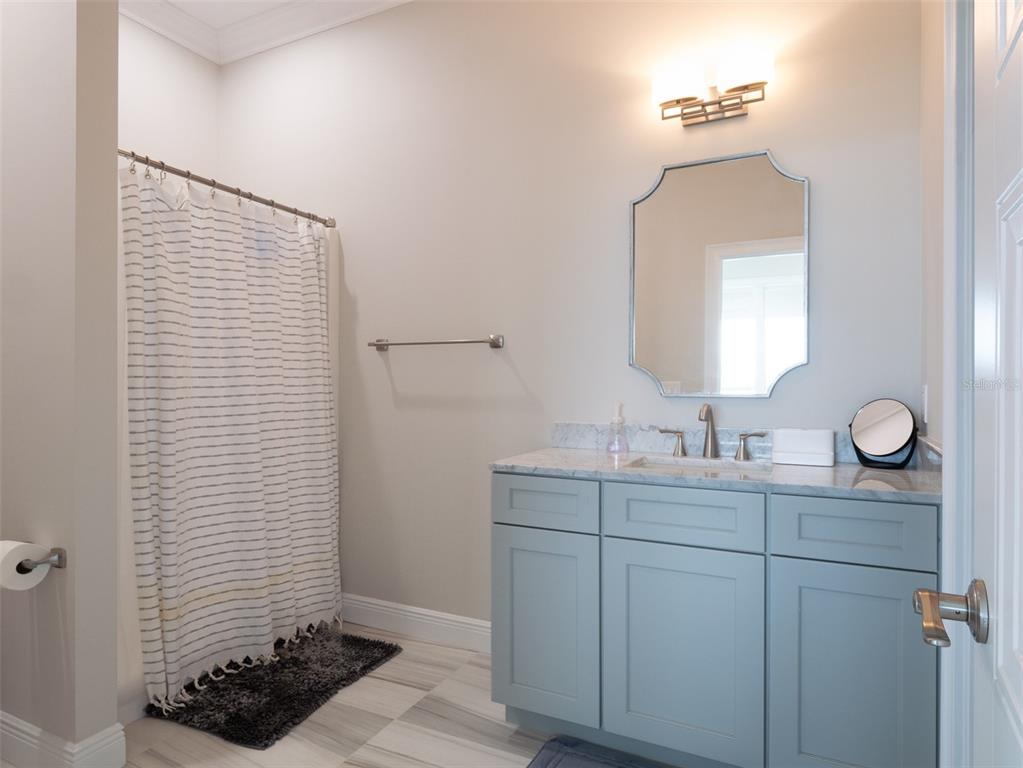 15225 Northwest 112th Place Road Morriston, FL 32668 - Photo 30 of 39 a bathroom with a double vanity sink and a mirror