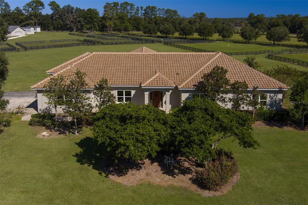 15225 Northwest 112th Place Road Morriston, FL 32668 - Photo 3 of 39 an aerial view of house with outdoor space and lake view
