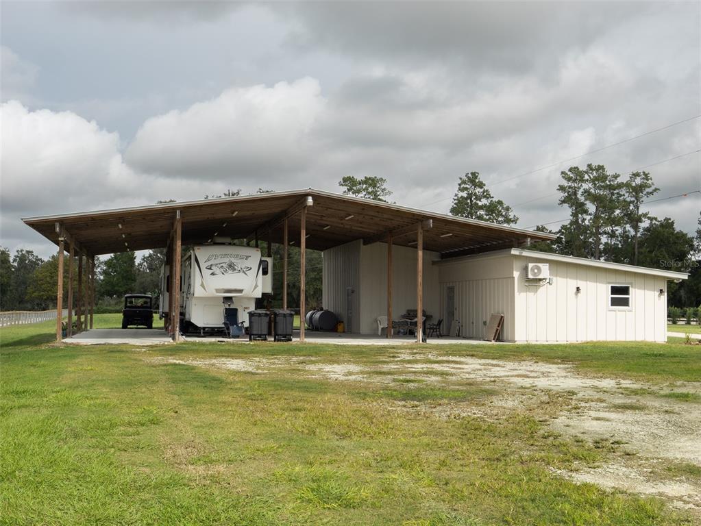 15225 Northwest 112th Place Road Morriston, FL 32668 - Photo 32 of 39 a view of a house with a backyard