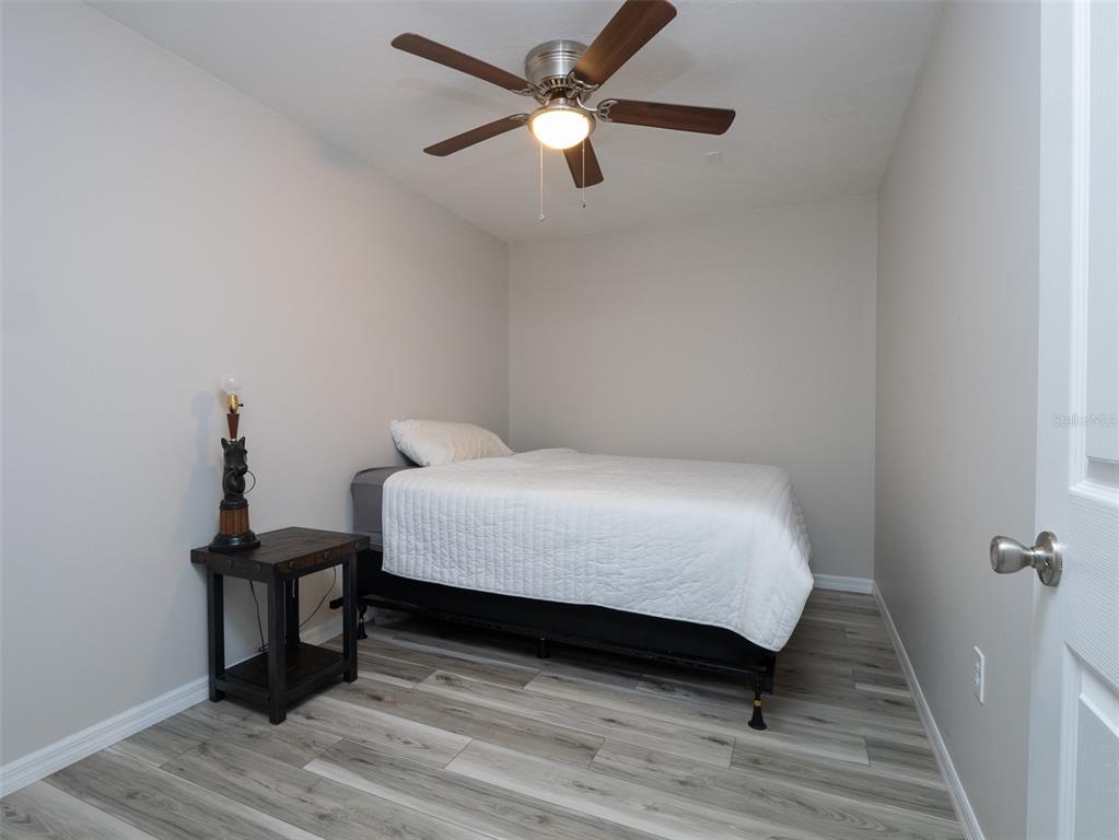 15225 Northwest 112th Place Road Morriston, FL 32668 - Photo 36 of 39 a bedroom with a bed and a table