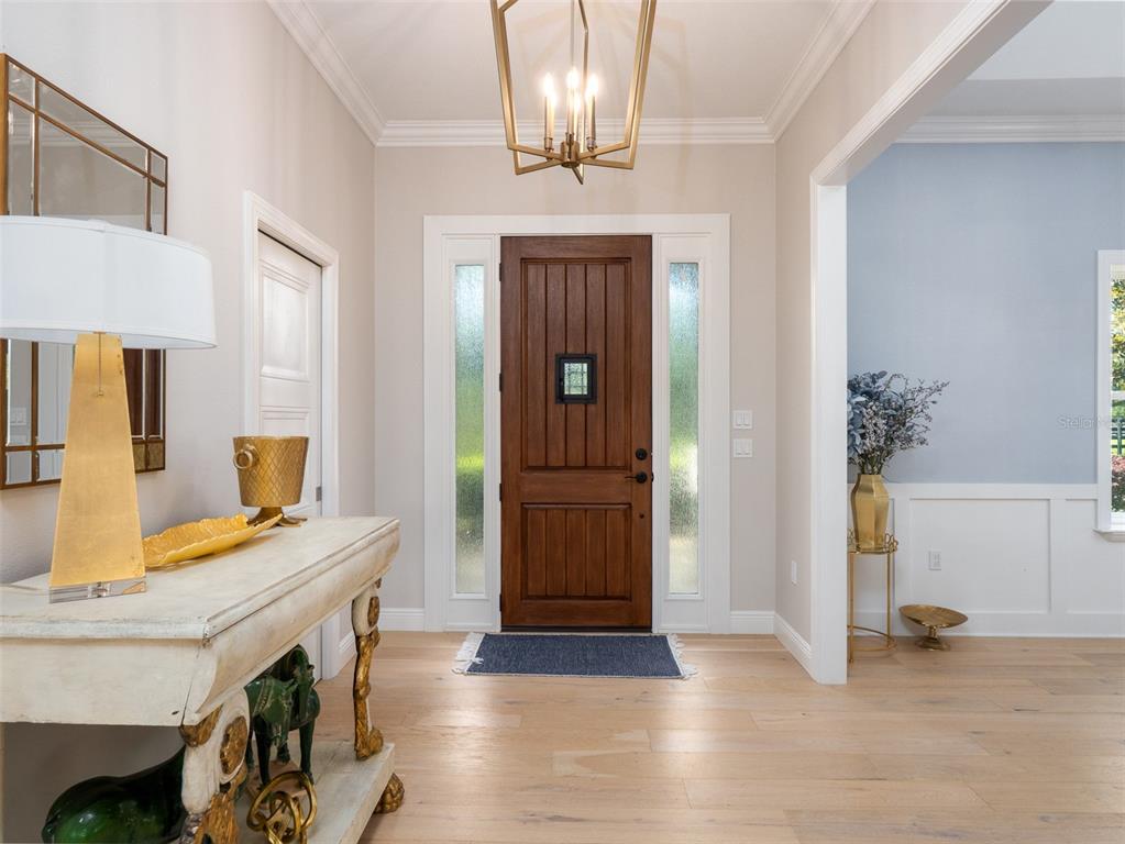 15225 Northwest 112th Place Road Morriston, FL 32668 - Photo 4 of 39 a view of a hallway with entryway and front door