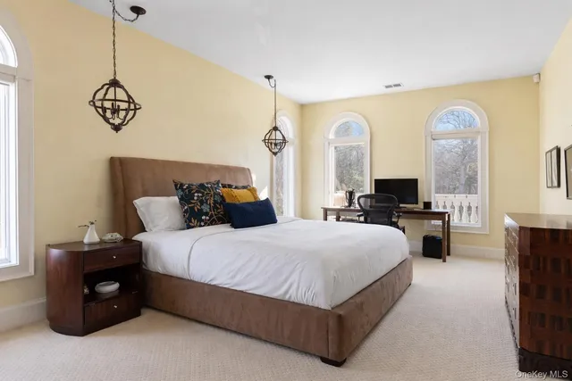 a bedroom with a bed and a couch