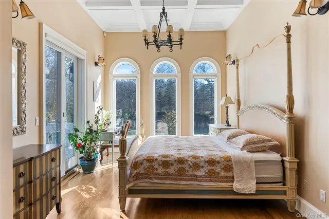 a spacious bathroom with a granite countertop sink and a mirror