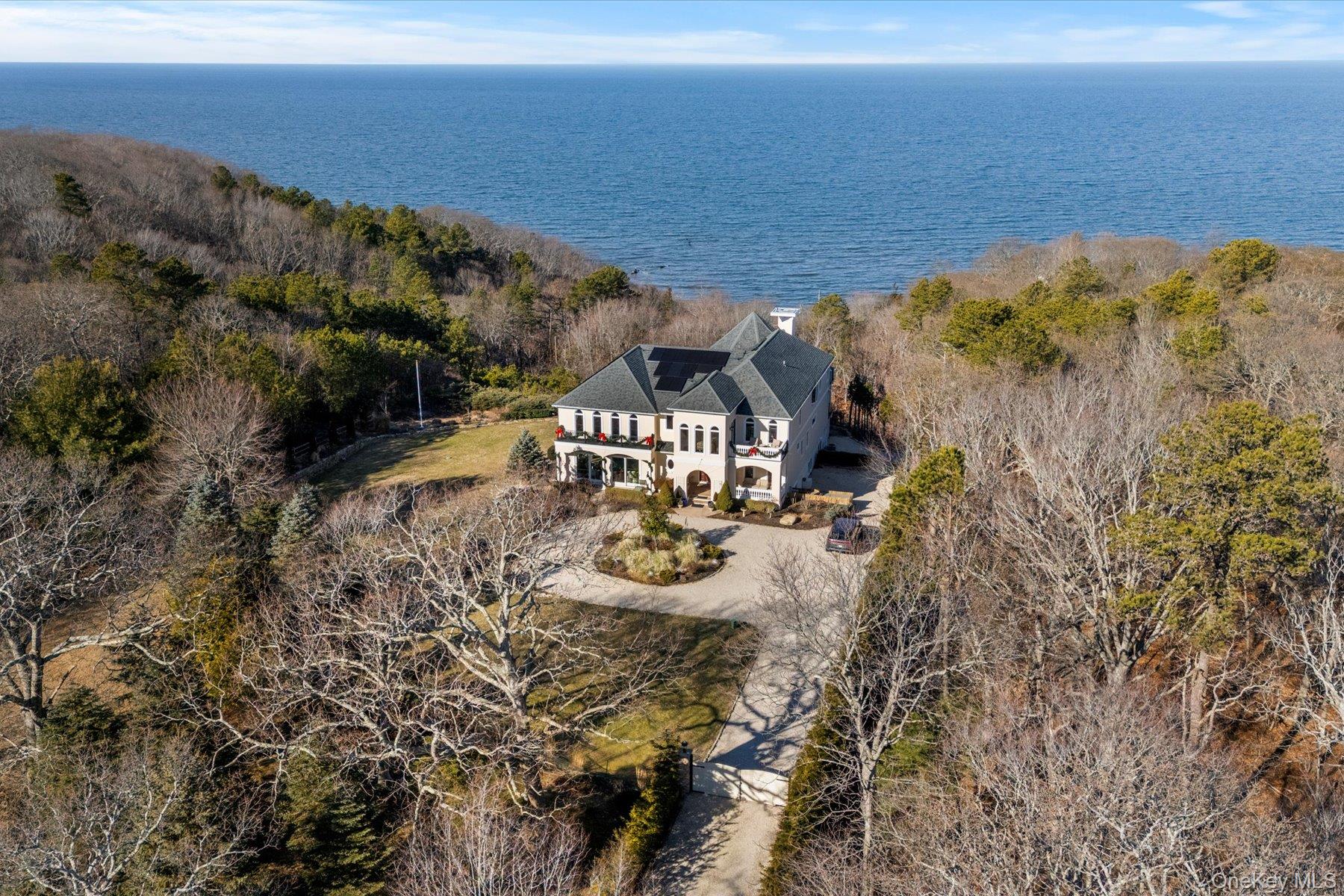3172 Sound Avenue Riverhead, NY 11901 - Photo 44 of 49 Surrounded by curated landscaping and open sky, the home enjoys a rare sense of space and tranquility overlooking Long Island Sound