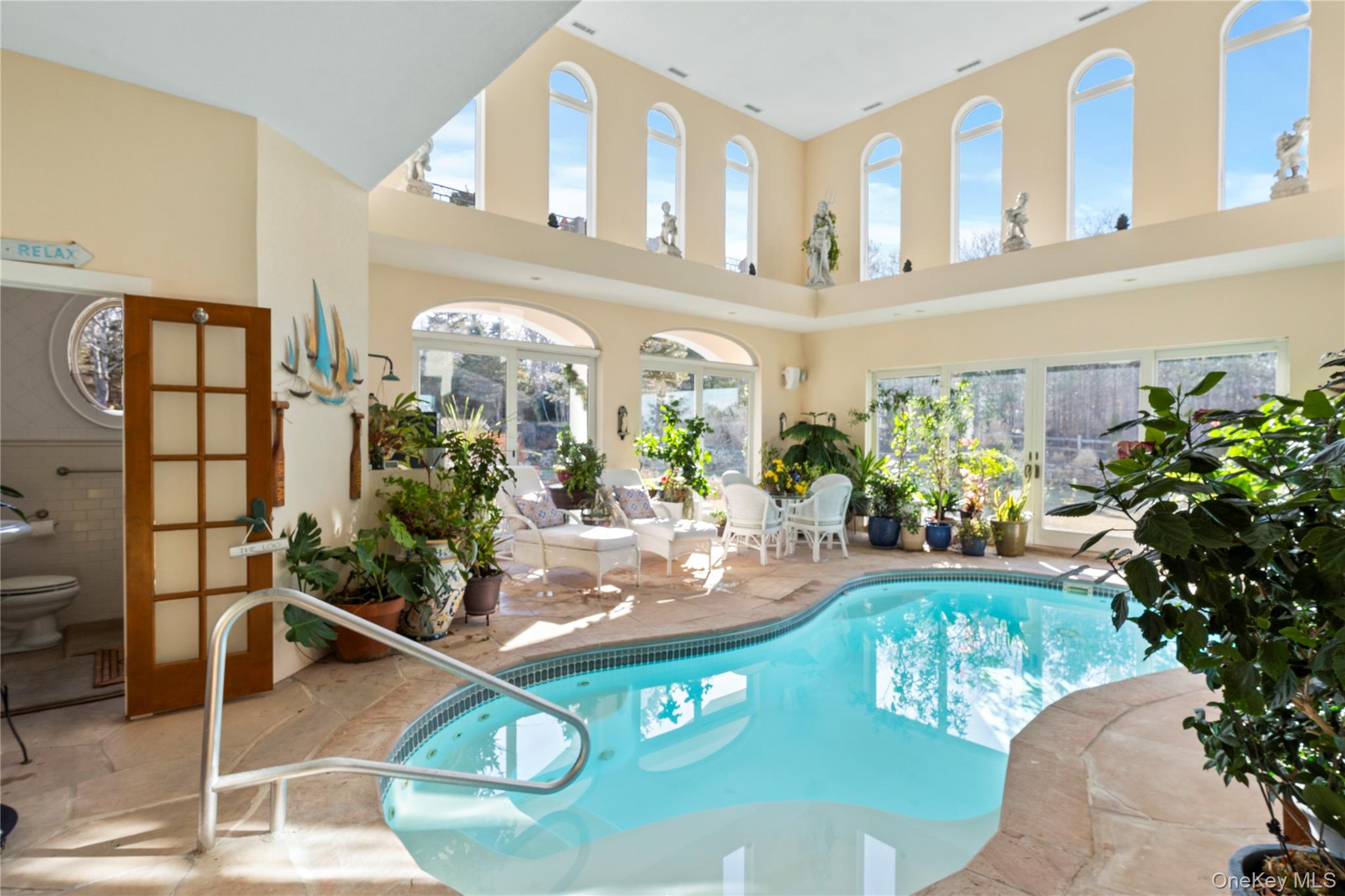 3172 Sound Avenue Riverhead, NY 11901 - Photo 5 of 49 Whether for morning laps or evening unwinding, the indoor pool delivers comfort and tranquility in every season