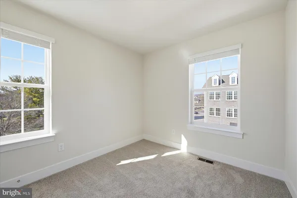 an empty room with closet area