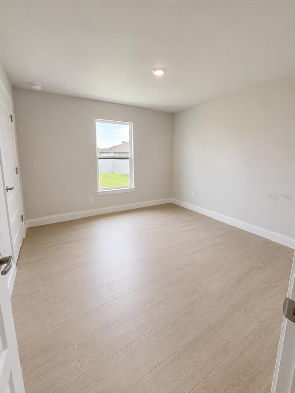 5892 Southwest 82nd Lane Ocala, FL 34476 - Photo 11 of 24 an empty room with a window