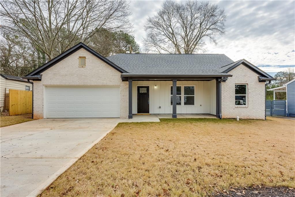 4221 Hanes Drive Decatur, GA 30035 - Photo 1 of 1 a view of a house with a yard and garage