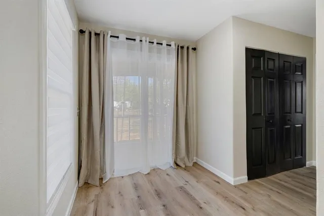 a view of entryway with wooden floor