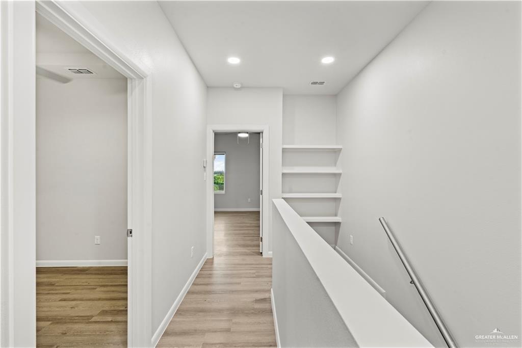 3512 Vanessa Lane, Unit 2 Weslaco, TX 78599 - Photo 11 of 21 a view of a hallway with wooden floor and entryway