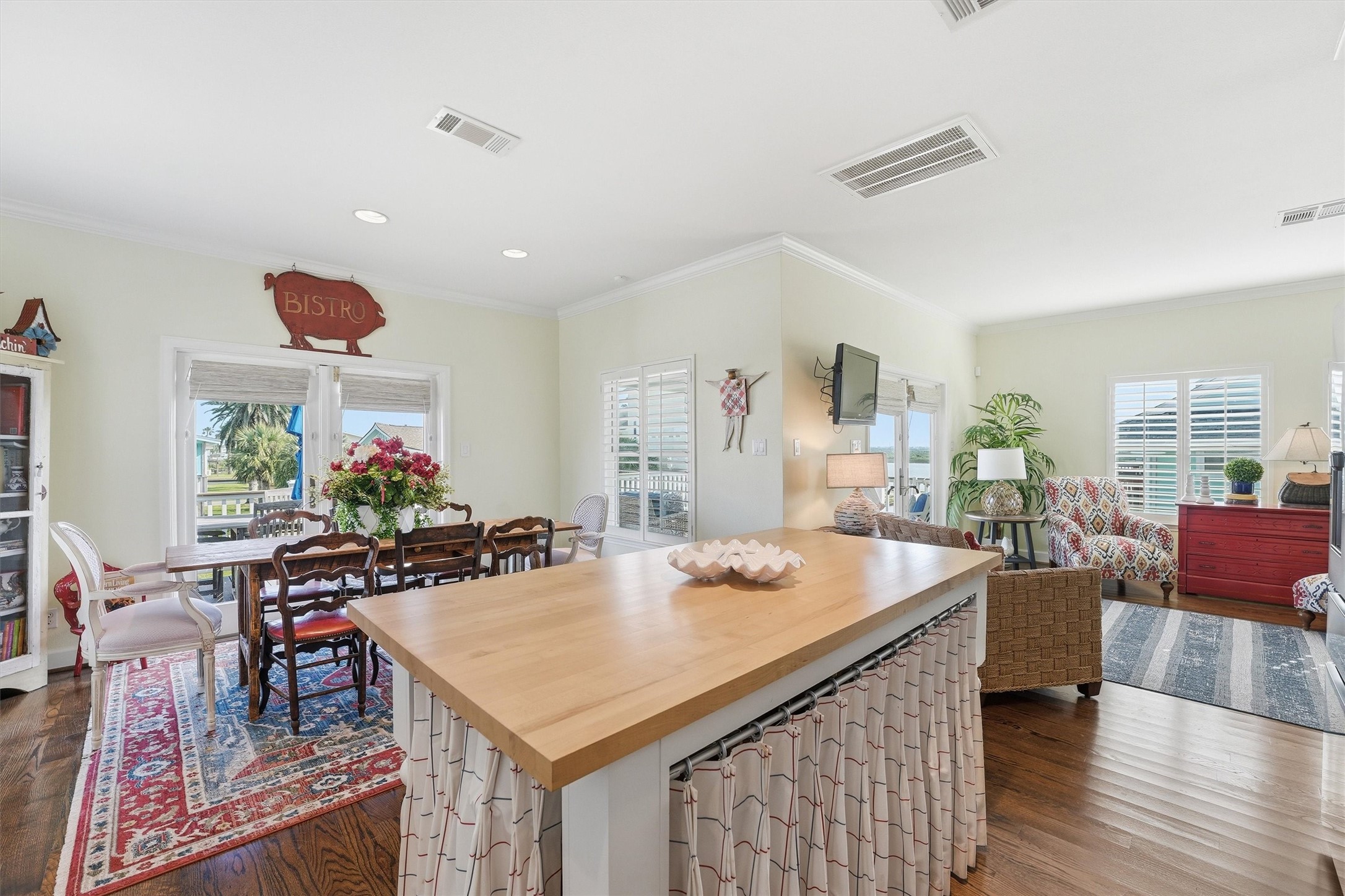 16635 Jamaica Cove Road Jamaica Beach, TX 77554 - Photo 11 of 45 a view of a dining room with furniture and wooden floor