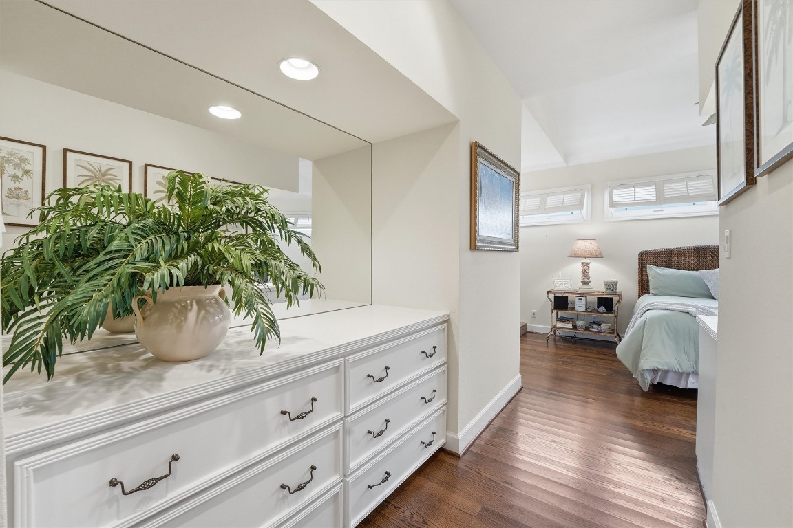 16635 Jamaica Cove Road Jamaica Beach, TX 77554 - Photo 20 of 45 a bedroom with furniture and a potted plant