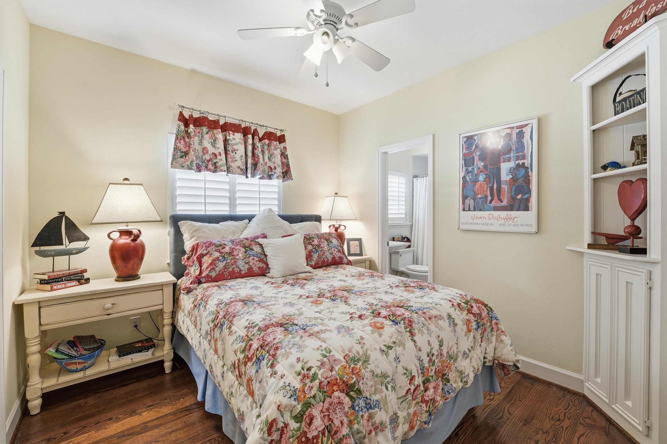 16635 Jamaica Cove Road Jamaica Beach, TX 77554 - Photo 25 of 45 a bedroom with a bed and a chandelier