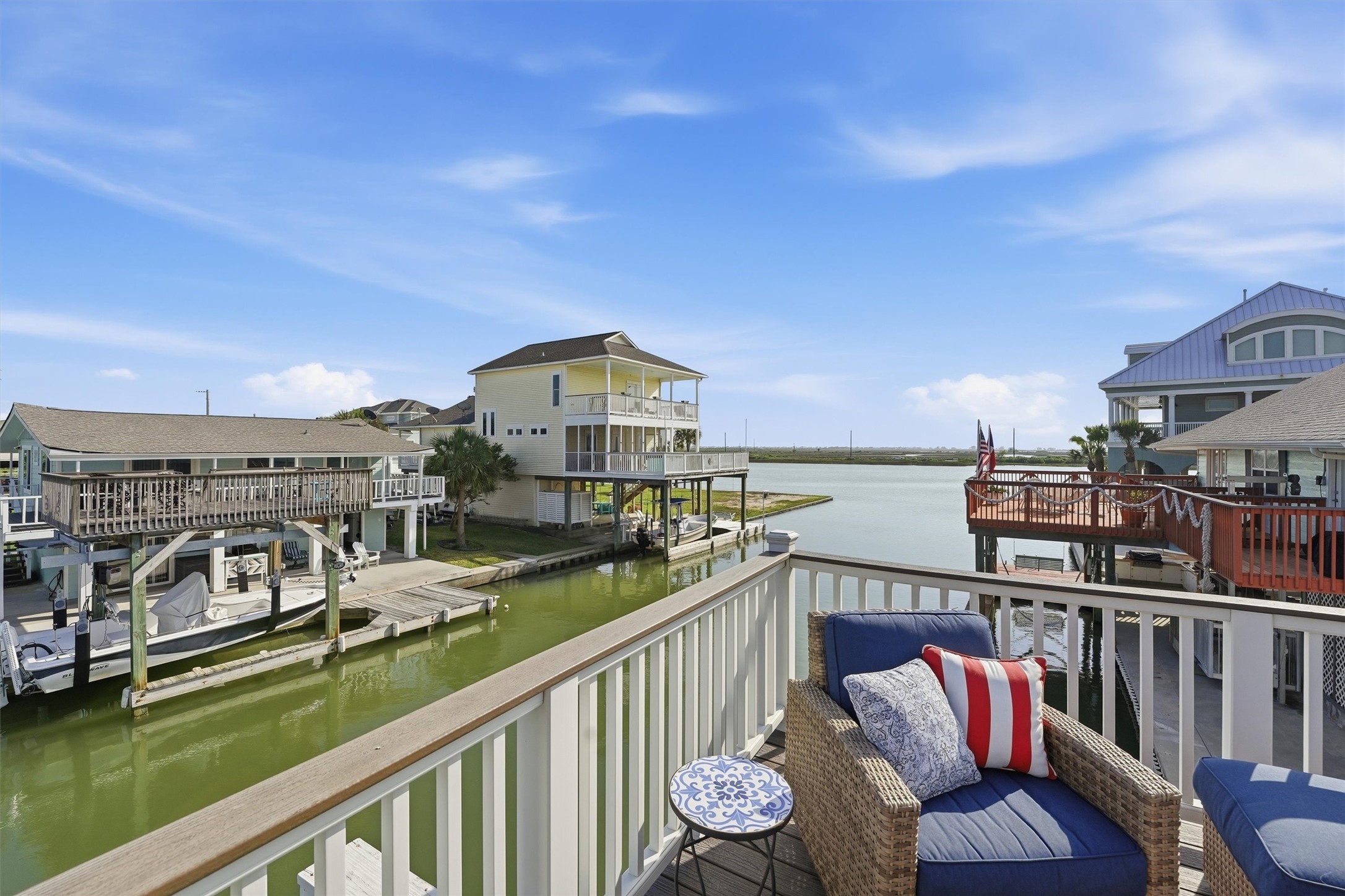 16635 Jamaica Cove Road Jamaica Beach, TX 77554 - Photo 36 of 45 a view of a balcony with two chairs and a table