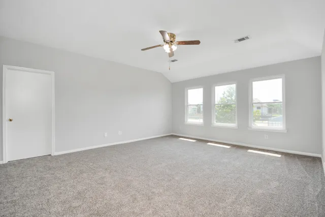 a view of an empty room with a window