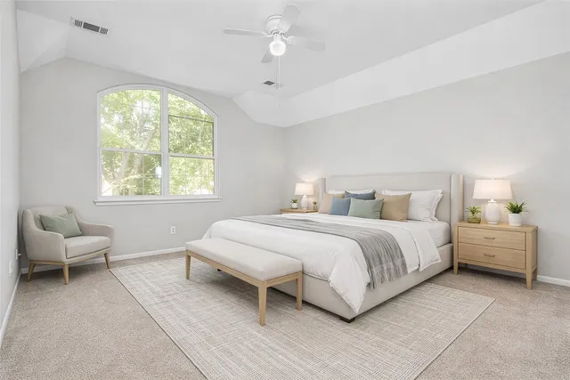 an empty room with wooden floor and a window