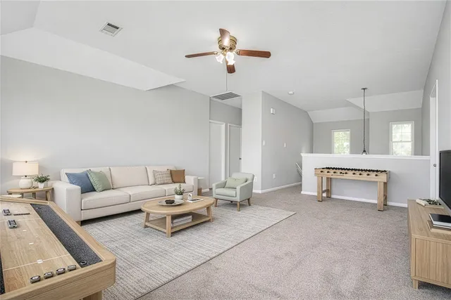 an empty room with wooden floor and fireplace