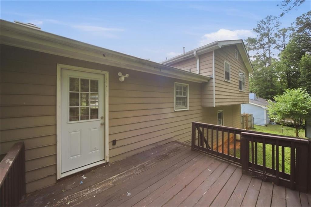 1496 Cherry Hill Road Southwest Conyers, GA 30094 - Photo 23 of 32 a view of a house with wooden deck
