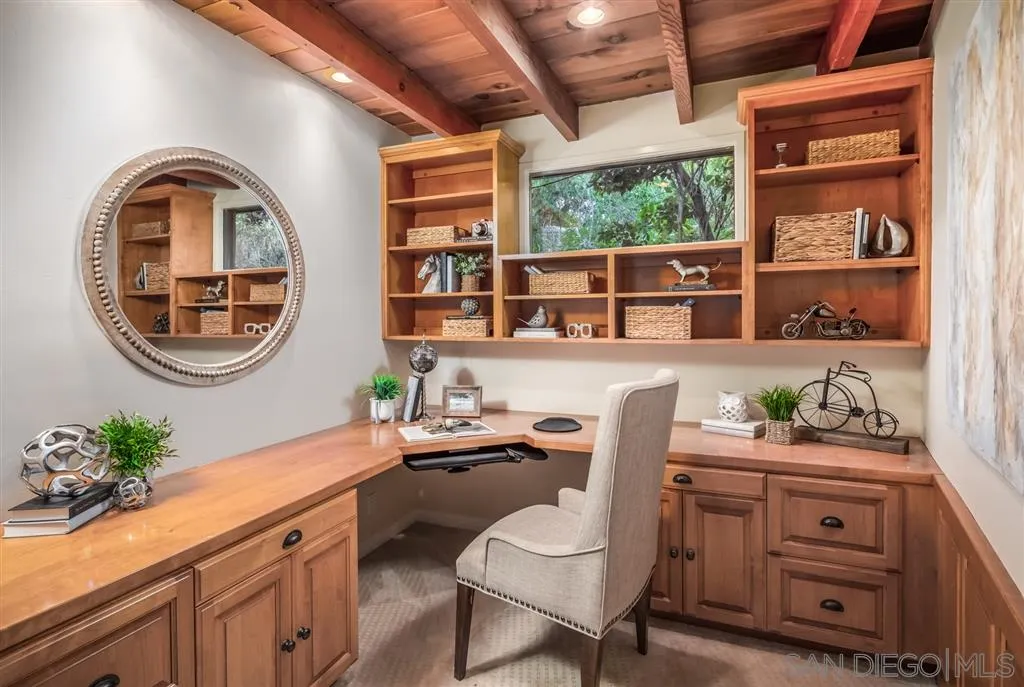 945 Crest Road Del Mar, CA 92014 - Photo 13 of 23 a reading room with furniture a rug potted plant and a window