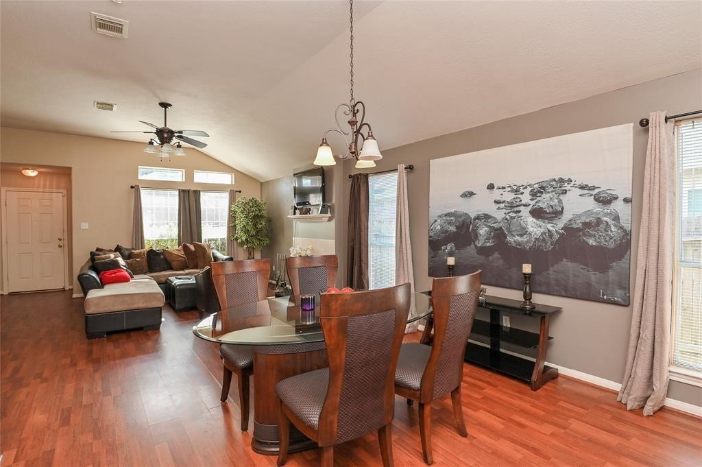 18446 South Wimbledon Drive Katy, TX 77449 - Photo 10 of 24 a view of a dining room with furniture window and wooden floor